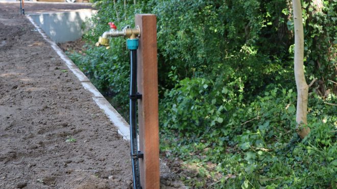 Beregeningsysteem in een tuin van Grastotaal